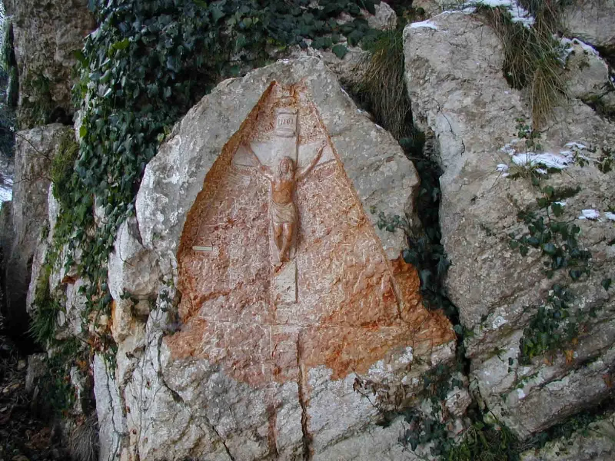 The crucifix carved directly into the rock face