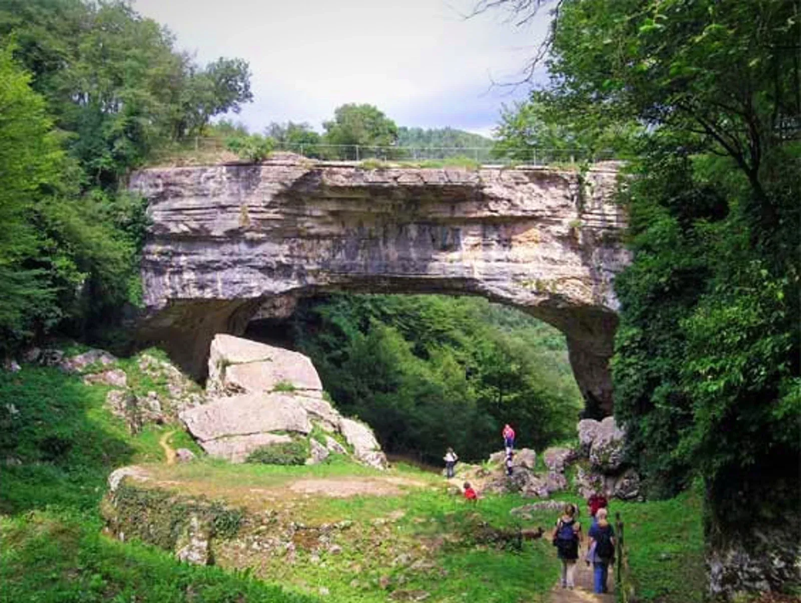 The Ponte di Veja seen from the trail, with visitors